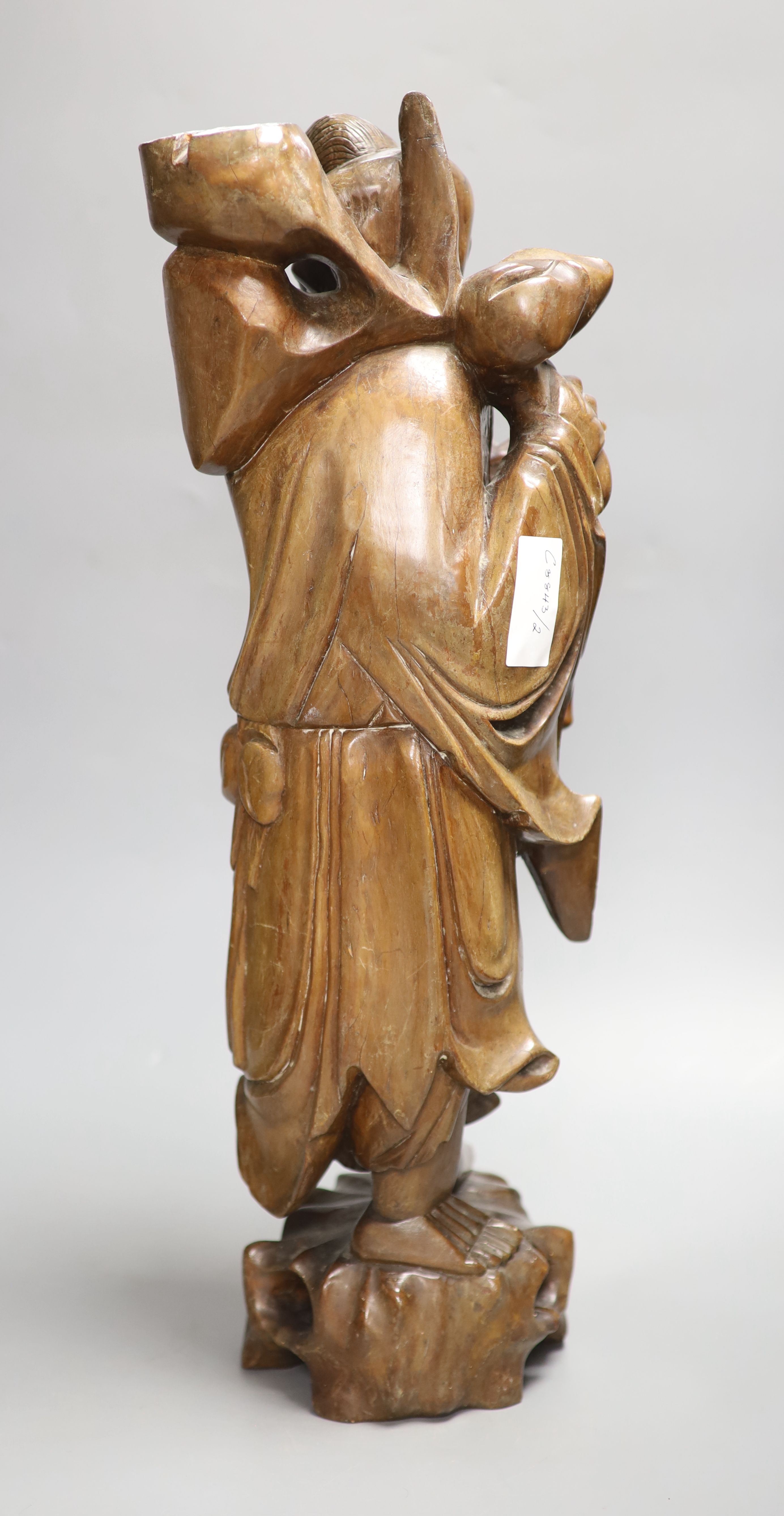 A Chinese hardwood carving of Shou, height 54cm